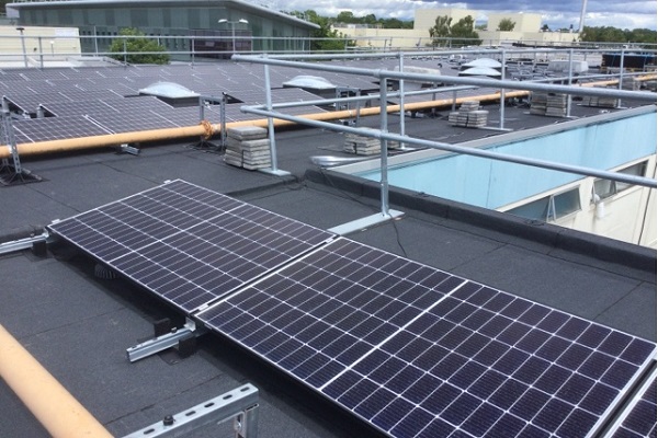 Flat roofing upgrade includes solar panel installation